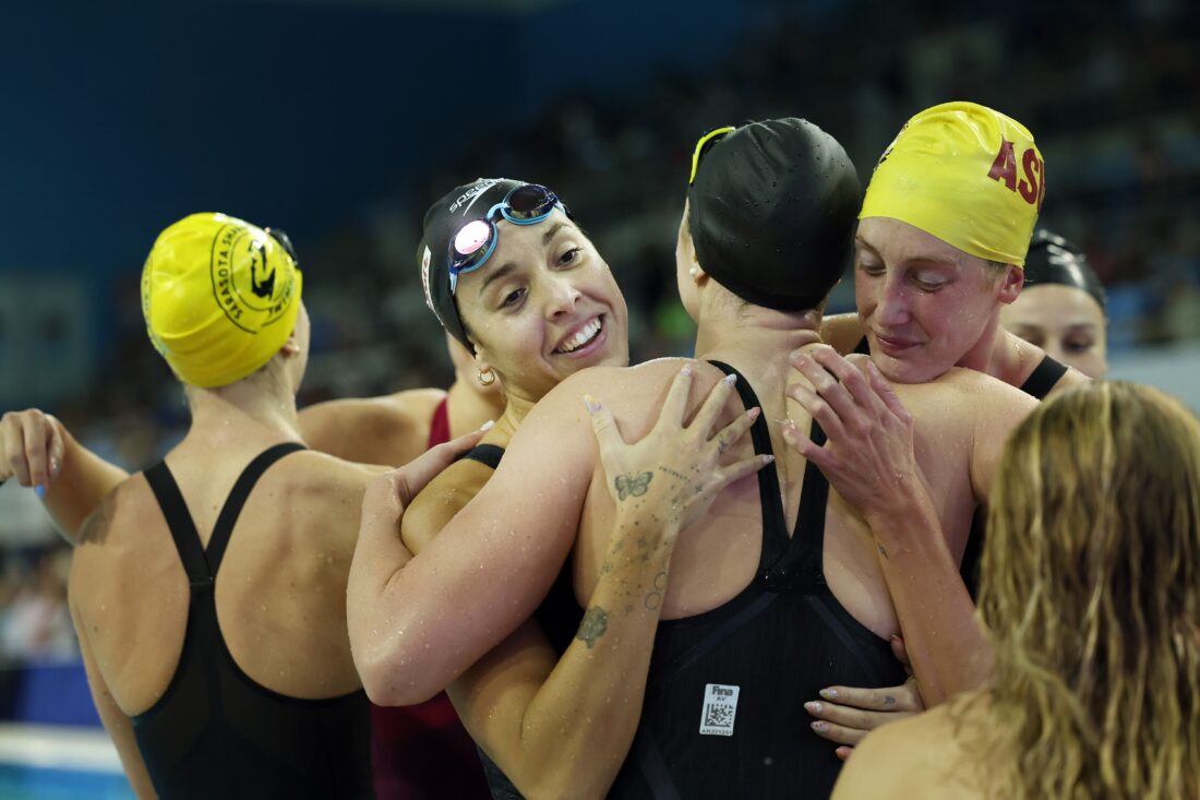 Mary-Sophie Harvey, left, and Taylor Ruck hug Penny Oleksiak - by Ian MacNicol